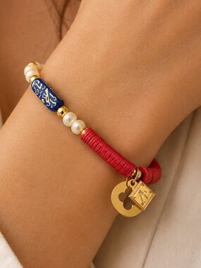 Anthropologie Red Heishi Bead Stretch Bracelet Blue Accent Gold Charm